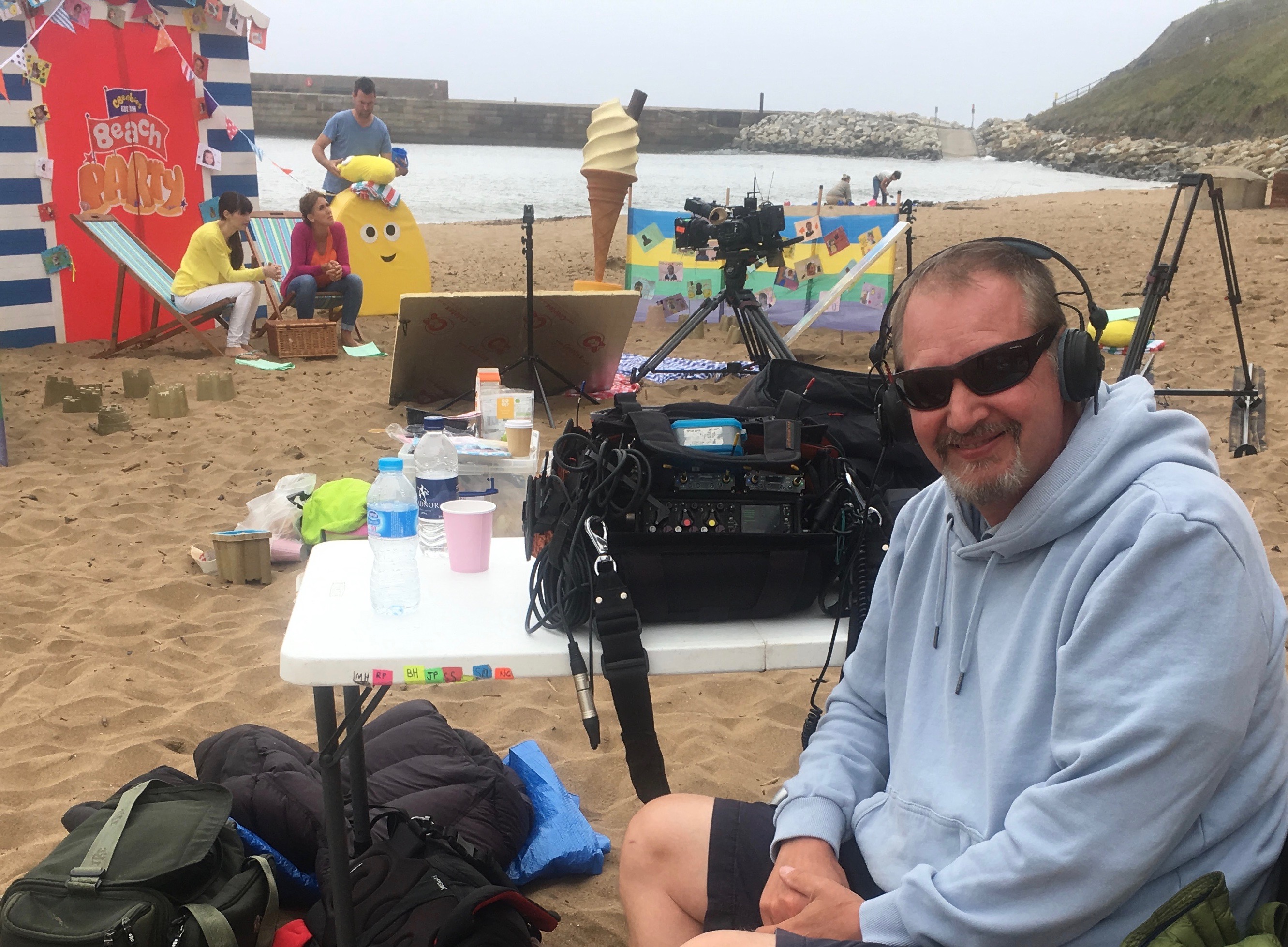 Mick recording on a beach